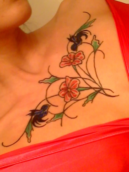 flowers tattoos on chest. chest tattoos female. Flowers