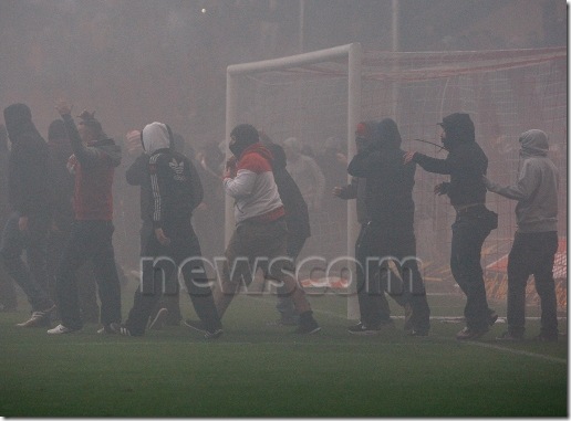 Supporters of 1.FC Cologne invade the pitch after their German Bundesliga first division soccer match against Bayern Munich in Cologne May 5, 2012. REUTERS/Ralph Orlowski (GERMANY - Tags: SPORT SOCCER) DFL LIMITS USE OF IMAGES ON THE INTERNET TO 15 PICTURES DURING THE MATCH AND, PROHIBITS MOBILE (MMS) USE DURING AND UP TO 2 HOURS POST MATCH. FOR MORE INFORMATION CONTACT DFL (Newscom TagID: rtrlfive221793) [Photo via Newscom]