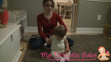 Baby with right torticollis doing a stretch