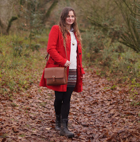 Girl in a red coat in winter