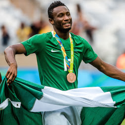 Mikel Obi with the Nigeria flag