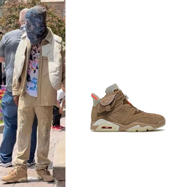 Travis Scott wearing Air Jordan 6 retro british khaki sneakers in Disneyland on May 19, 2021