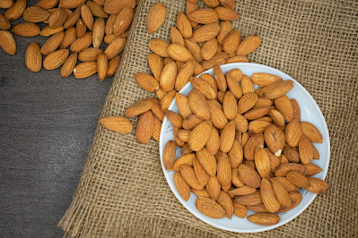 The nuts highest in protein are peanuts, almonds, pine nuts, pistachios, hazelnuts, pine nuts, cashews, walnuts and Brazil nuts.