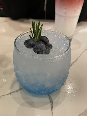 A captivating blue cocktail, the Blue Hawaii Magnolia Sparkle, from Sister's Thai Restaurant