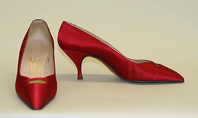 Red pointy pumps