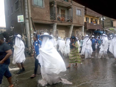 Photos: Eyo masquerades defy rainfall, move around in their attire