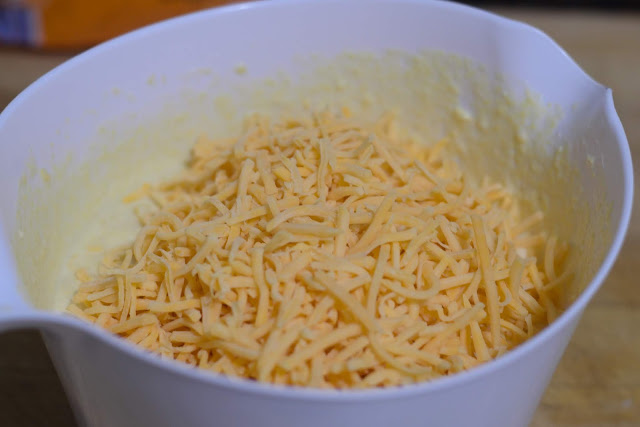 Add the shredded cheese to the mixing bowl.