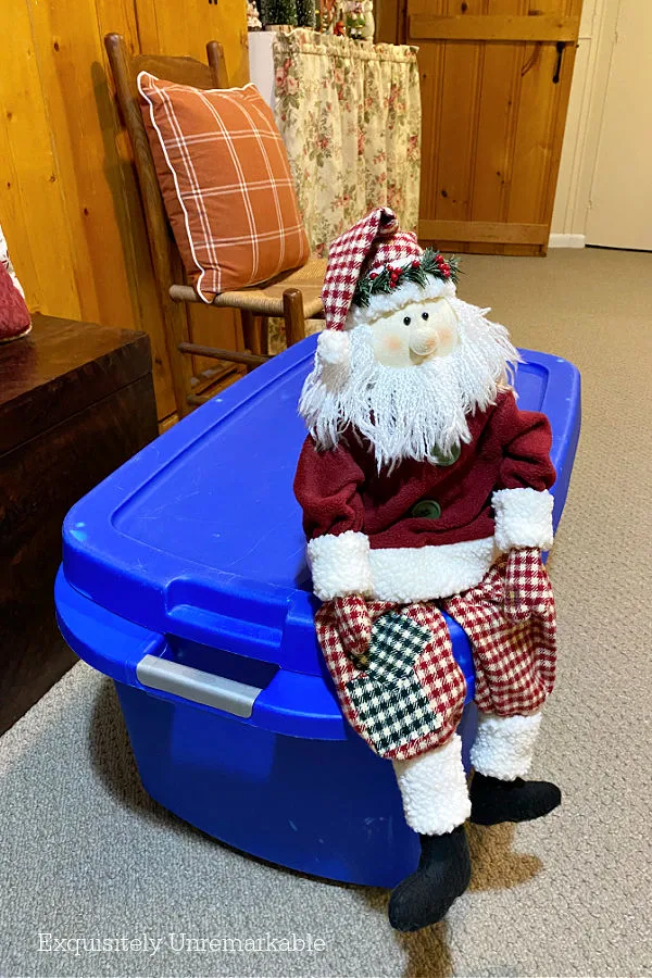 Blue Plastic Bin For Christmas Storage with Santa sitting on top