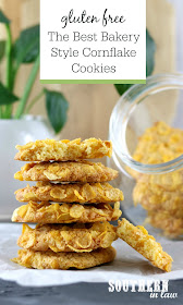 Classic Gluten Free Cornflake Cookies Recipe - Classic cornflake cookies in a stack in front of glass cookie jar in white kitchen