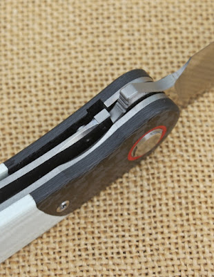 A Titanium liner lock with steel insert and overtravel stop