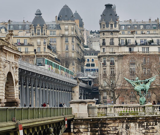 metro train on the Pont Bir-Hakeim bridge in Paris