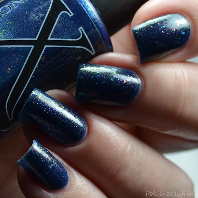 blue nail polish with shifting shimmer and flakies