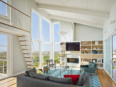 Lovely Interior Living Room with Grey Sofas, Blue Carpet, Hardwood Floor, White Ceiling and Glass Table