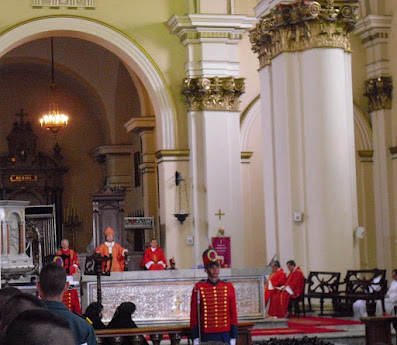 Strength in belief: The Archbishop of Bogotá, Jesús Rubén Salazar Gómez, looking all-powerful seated on his 'throne' during Good Friday ceremonies at the main Cathedral in the Colombian capital