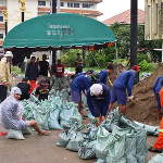 Firemen and Volunteers Filling Sandbags at the Fire Dept.