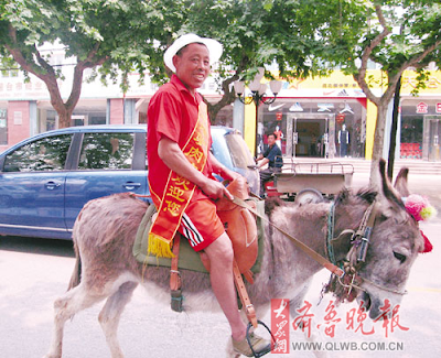 Man Rides Donkey to Promote Donkey Meat Restaurant