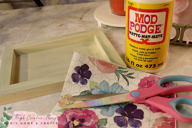 Scissors, decorative napkin and Mod Podge