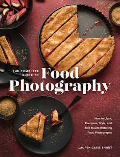 Burgundy book cover showing a cut fruit pie