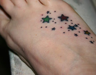 smal tattoos star on foot for girls
