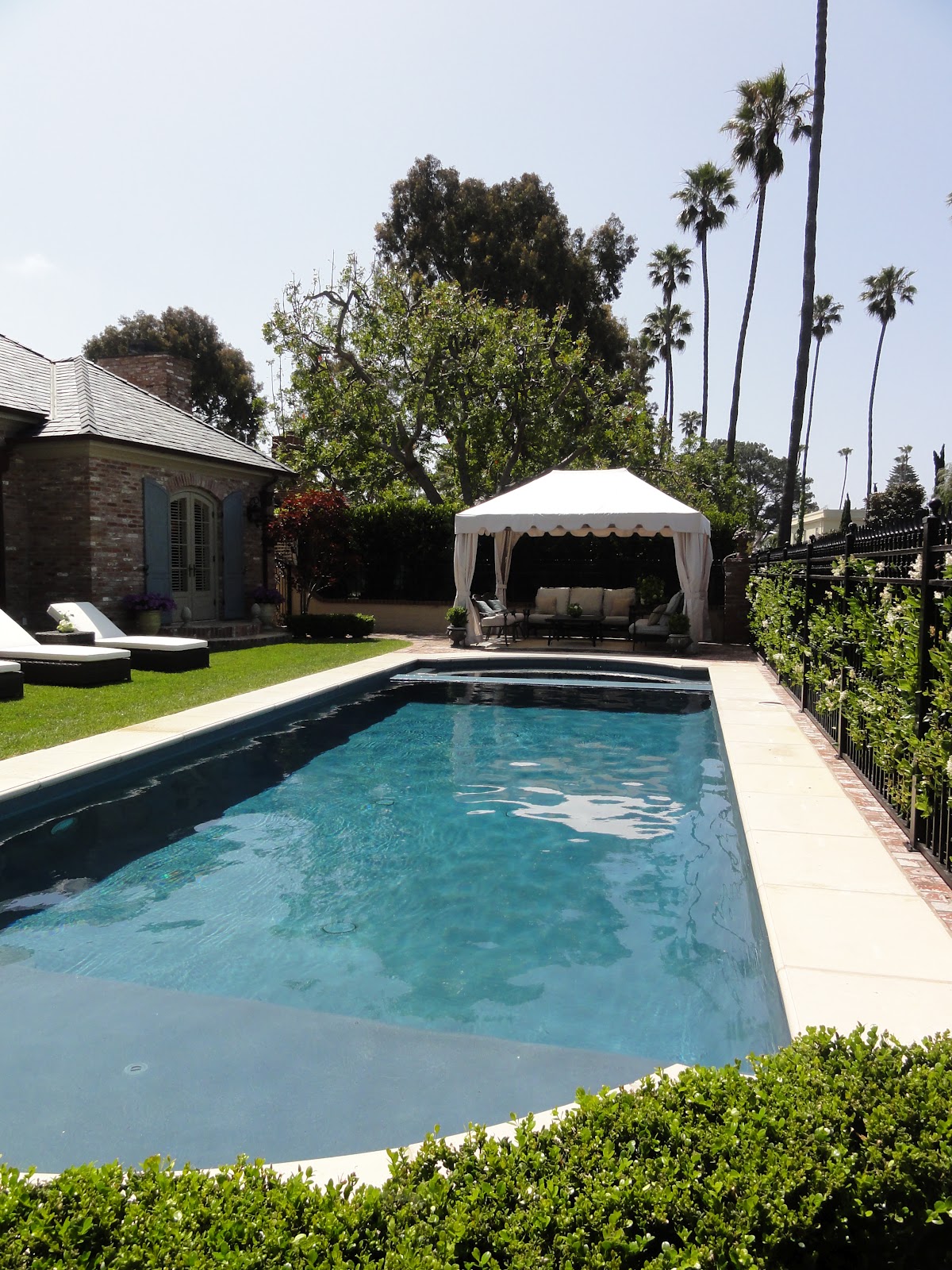 The first home had the swimming pool in the front yard, rather than in  title=