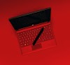 black pen on red laptop computer