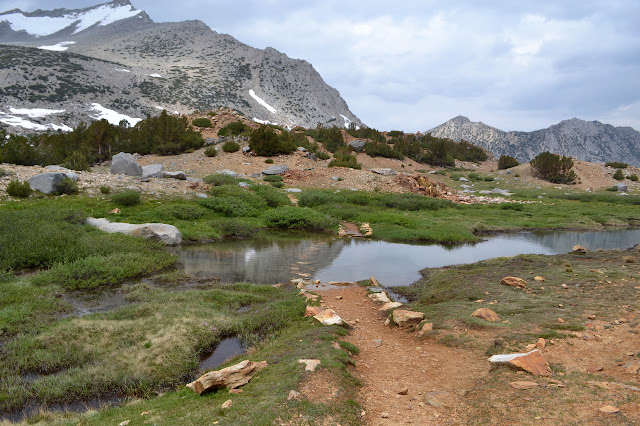 water across the trail