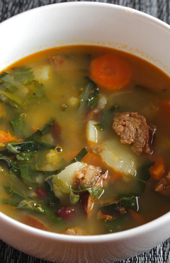 Cooking Chat's Best Portuguese Kale Soup is a delicious way to enjoy healthy kale! Sausage, beans and potatoes simmer along with the kale and plenty of garlic for a hearty, full-flavored soup.