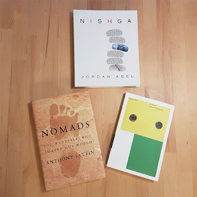 Three books on a table, Nisgha, Good Girl, and Nomads
