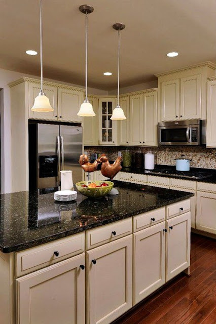white kitchen cabinets with black countertops