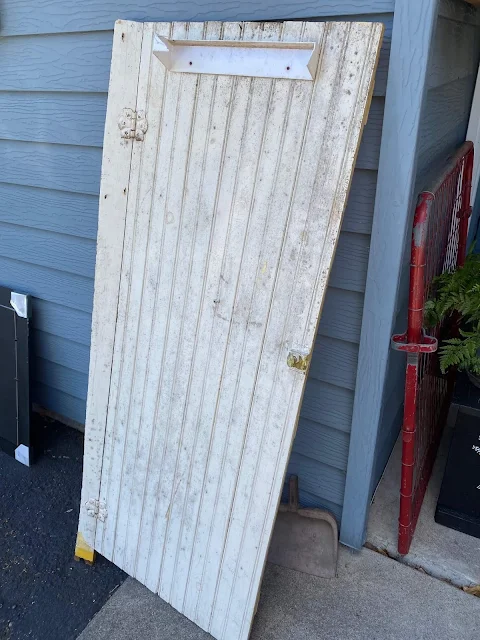 Photo of grubby beadboard cabinet door