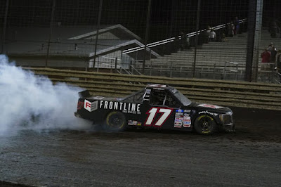 Todd Gilliland performs a burnout after his win.