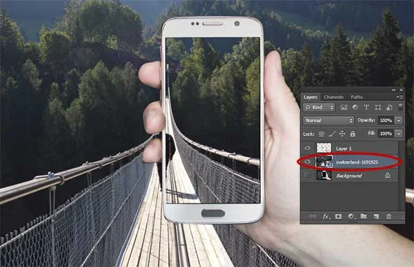Move this layer below the frame/smartphone layer.