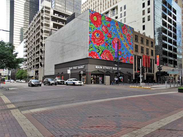 Main Street Market with rose-adorned facade 