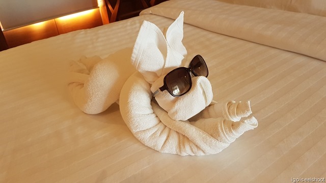 towel origami rabbit wearing one of our sun-glasses 