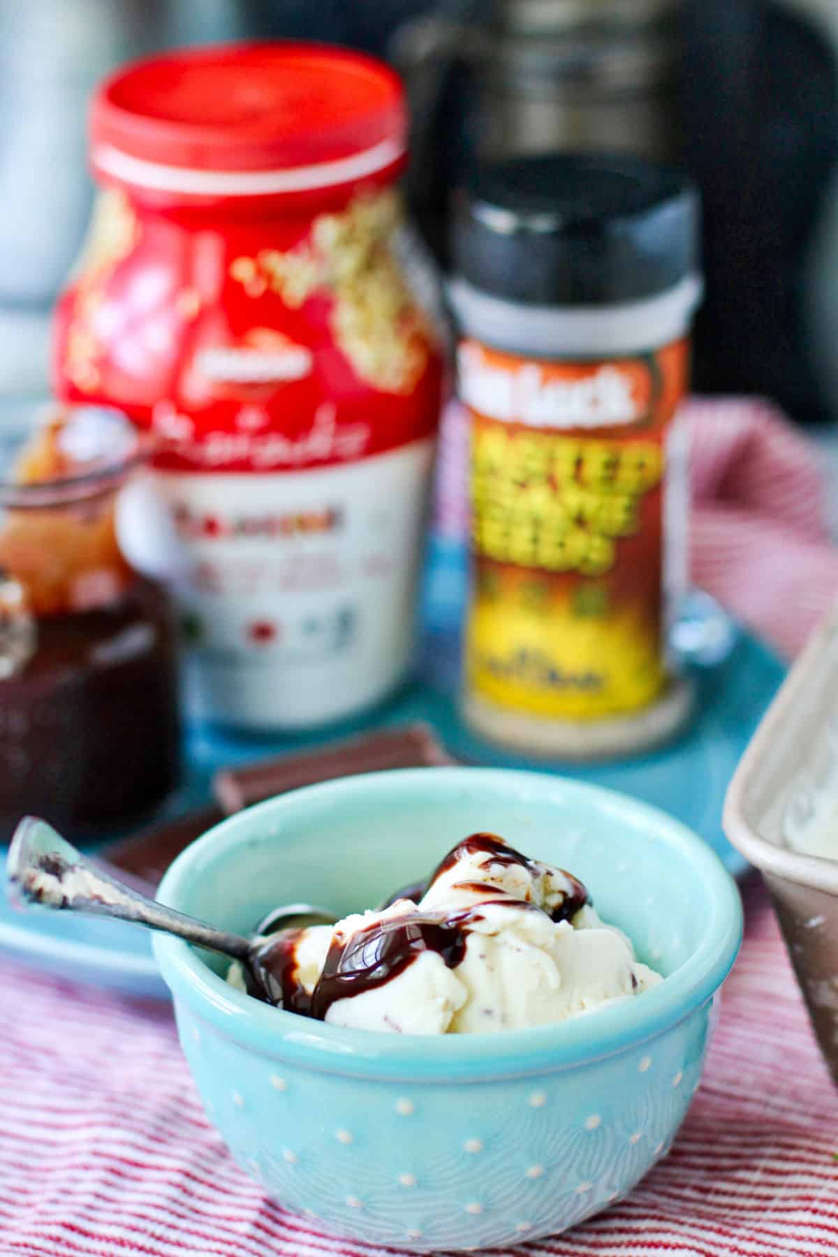 Tahini ice cream in a small blue bowl.