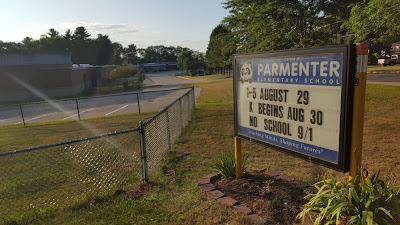 Parmenter school sign with the opening week schedule