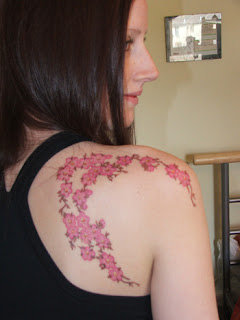 Cherry Blossom Tattoo on Girls Upper back and Shoulder