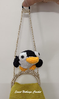 Sweet Nothings Crochet free crochet pattern blog, free crochet pattern for a penguin towel ring holder, photo of the Penguin Towel Ring Holder / topper