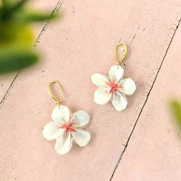 pair of white paper cherry blossom earrings with golden ear wires