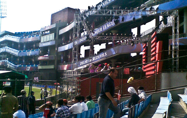 Mobile Clicks of IPL Match between Delhi DareDevils and Chennai Super Kings on 19th March 2010 @ Firoz Shah Kotla, Delhi, INDIA: Posted by VJ on PHOTO JOURNEY @ www.travellingcamera.com : VJ, ripple, Vijay Kumar Sharma, ripple4photography, Frozen Moments, photographs, Photography, ripple (VJ), VJ, Ripple (VJ) Photography, VJ-Photography, Capture Present for Future, Freeze Present for Future, ripple (VJ) Photographs , VJ Photographs, Ripple (VJ) Photography : I don't follow cricket and but know few players who have big name in the world of Cricket. On Friday we had an office outing to Firoz Shah Kotla to watch IPL Match between Delhi DareDevils and Chennai SuperKings...Cameras were not allowed inside the stadium :(  But I managed with my Nokia Phone :): This Stadium was originally a fortress built by Sultan Ferozshah Tughlaq to house his version of Delhi city called Ferozabad. A pristine polished sandstone pillar from the 3rd century B.C. rises from the palace's crumbling remains, one of many pillars left by the Mauryan emperor Ashoka; it was moved from Punjab and re-erected in its current location in 1356. The Feroz Shah Kotla was established as a cricket ground in 1883. The first test match at this venue was played on November 10, 1948 when India took on the West Indies. Anil Kumble took 10 wickets in an inning on this ground in 1999, only the second time this feat has been achieved in test cricket. It is owned and operated by the DDCA (Delhi District Cricket Association). Since 2008 the stadium has been the home venue of the Delhi DareDevils of the Indian Premier League. On 27th December 2009, an ODI match between India and Sri Lanka called off because pitch conditions were classed as unfit to host a match. The ICC is currently conducting an investigation, and a possible sanction could include the Feroz Shah Kotla being rejected as a venue for the 2011 Cricket World Cup. DJ Stage @ Feroz Shah Kotla, DELHI I assume this was IPL arrangement and the song they were playing were very biased. Most of the viewers may ignore because they were cheering for Delhi but I personally didn't liked it...