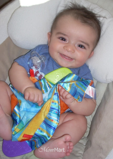 My son with his Bright Starts cuddle & Soothe Blanket