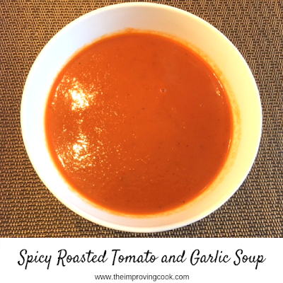 Tomato soup in a white bowl.