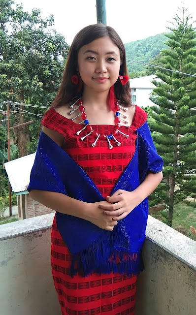 A young Ao lady wearing traditional dresses