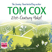 21st-Century Yokel audiobook cover. A man walks along a path on green hills, with the chalk outlines of a cat, badger, and sheep on each one (from left to right).
