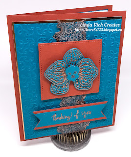 Linda Vich Creates: Ornate Orchid. Copper embossed climbing orchid sits atop a Cajun Craze stitched square. Ruffled copper trim and Island Indigo matte embossed with the Garden Trellis embossing folder as well as some copper foil and this card screams, "ornate!"