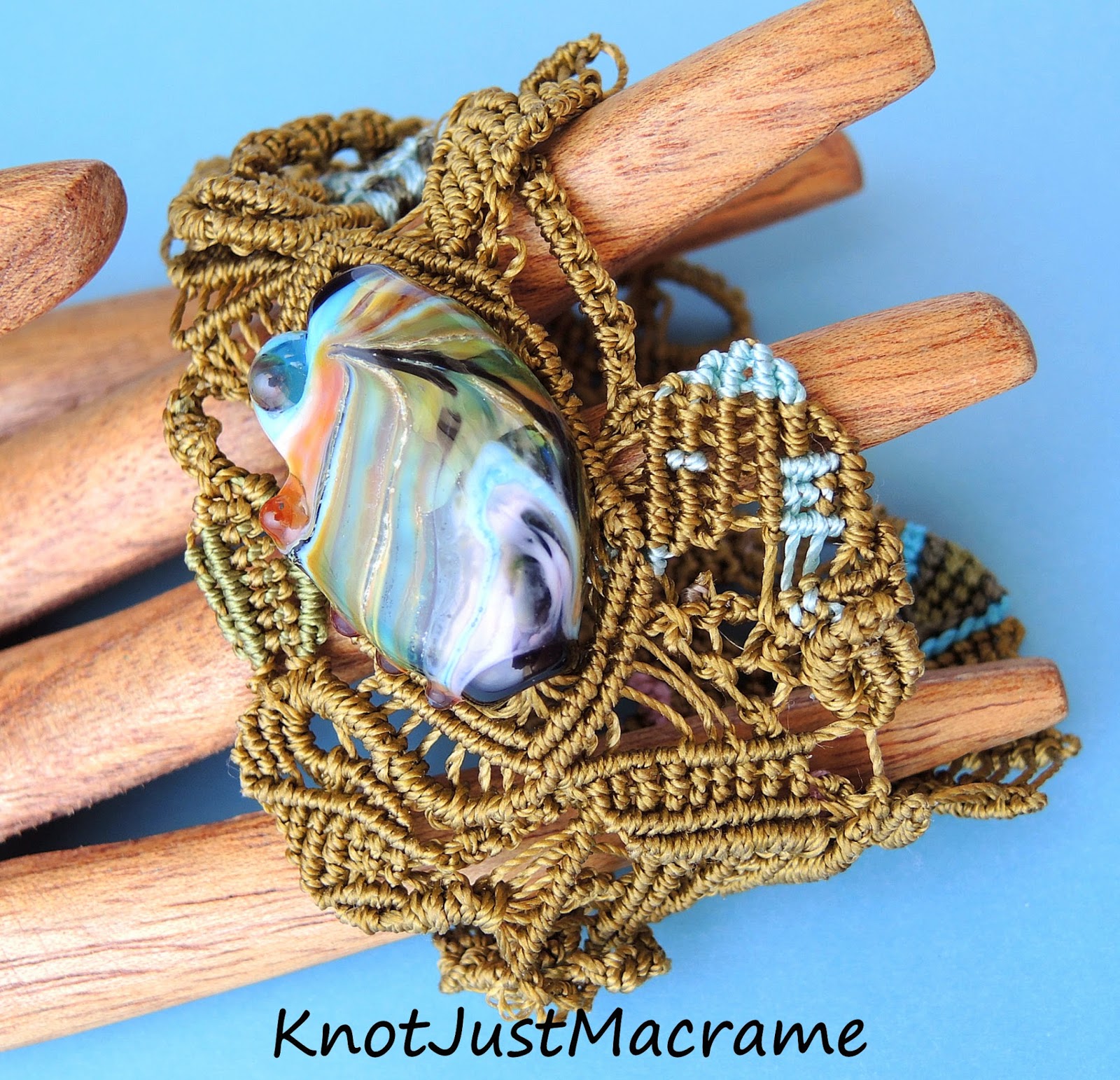 Free form micro macrame bracelet by Knot Just Macrame with lamp work focal by Laurie Ament.