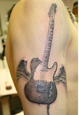 guitar with wings tattoo on shoulders men