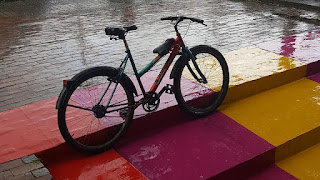 bicycle in the rain on an urban street