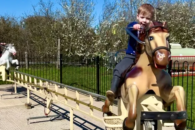 A preschool on a galloper horse ride