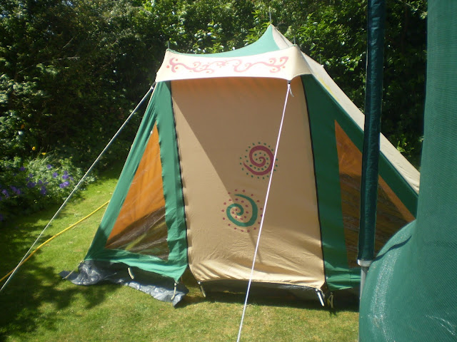 painting a canvas tent with fabric paints